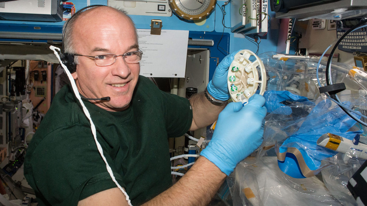 NASA Astronaut Jeff Williams conducts operations for the WetLab 2 validation study aboard the space station.