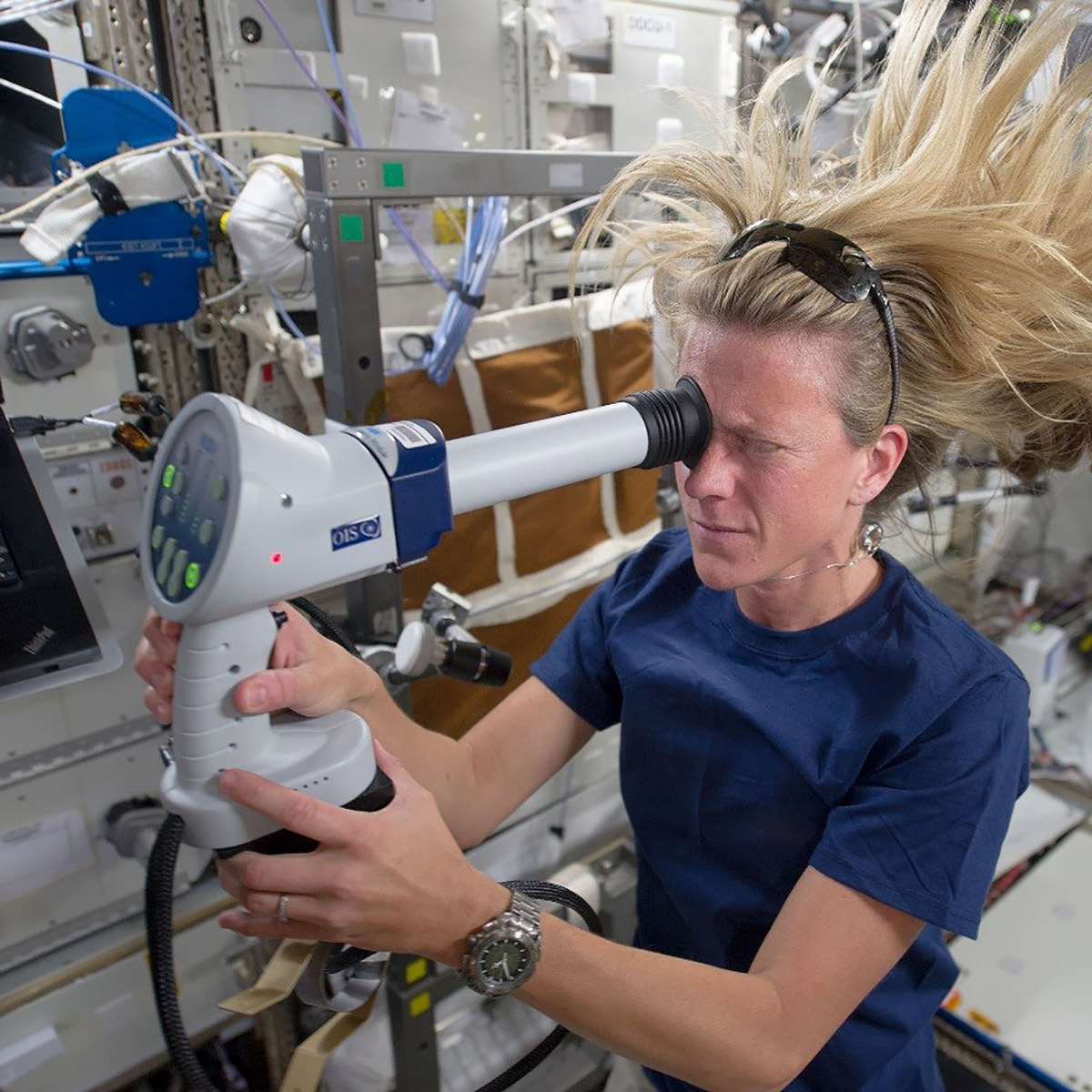 NASA astronaut Karen Nyberg, Expedition 36 flight engineer, conducts an ocular health exam.