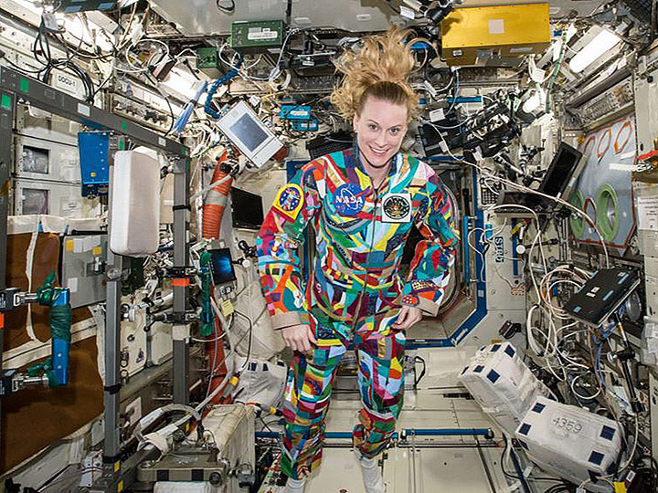 ISS049e000760 (09 09 2016) Expedition 49 Flight Engineer Kate Rubins of NASA wears a hand painted spacesuit decorated by patients recovering at the MD Anderson Cancer Center to raise awareness about the benefits of pairing art with medicine. Three spacesuits, HOPE, COURAGE and UNITY, were created during the project. Spacesuit UNITY was created at cancer hospitals in Germany, Russia, and Japan with collaboration from astronauts from NASAs international partners, ESA (European Space Agency), the Russian Federal Space Agency and the Japan Aerospace Exploration Agency. Rubins is seen wearing the COURAGE suit.