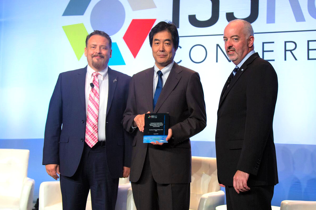 On behalf of the Kibo Mouse Habitat Unit Mission Team of JAXA, Dr. Masaki Shirakawa accepted a 2019 ISSRDC award for innovation in biology and medicine.