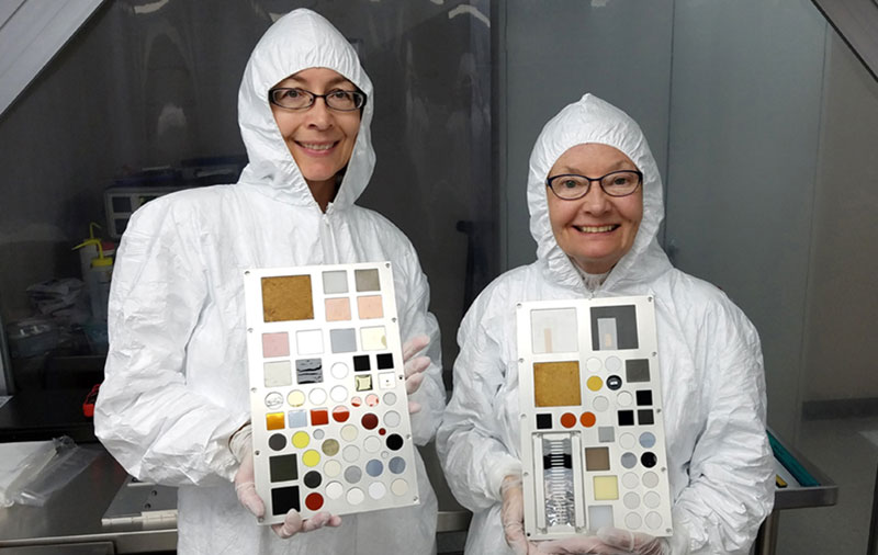 Kim de Groh (left) and Sheila Thibeault with their material samples to be tested on MISSE 9.
