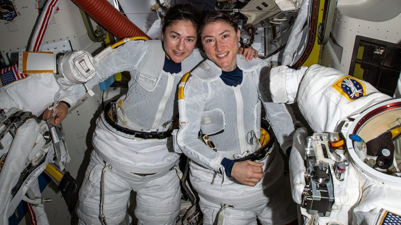 NASA astronauts Jessica Meir (left) and Christina Koch (right) to prepare to leave the hatch of the International Space Station and begin the historic first ever all female spacewalk.