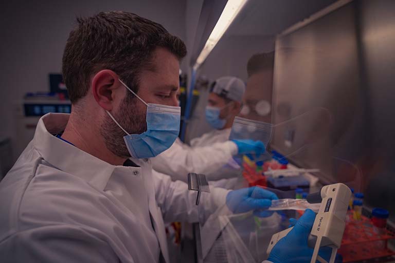 BioServes Brian Medaugh (forefront) and Dr. Luis Zea (background) preparing the cells for integration into the flight hardware at EVMS ahead of the NG 17 launch.