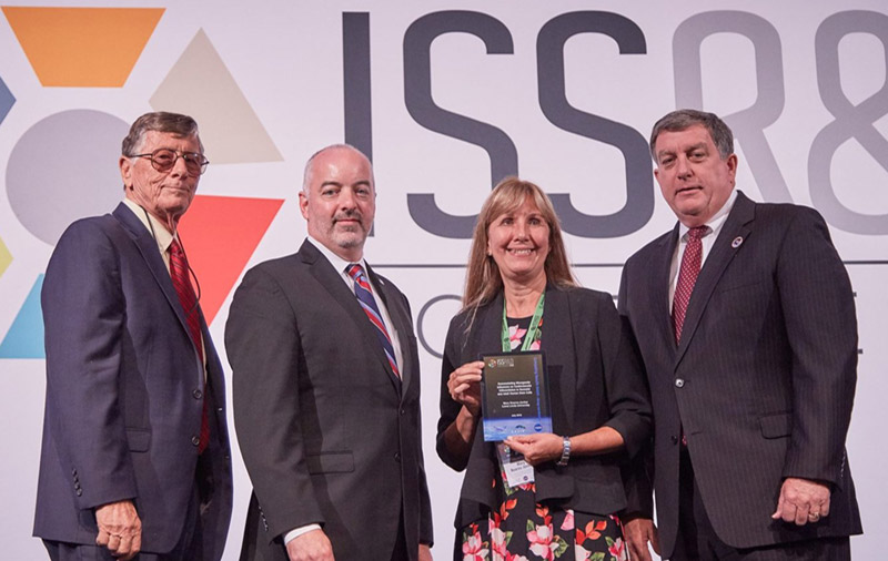 Mary Kearns Jonker receives the 2018 International Space Station Compelling Results Award in Biology and Medicine.