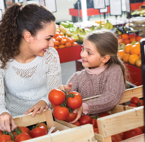 mom and child with tomatoes