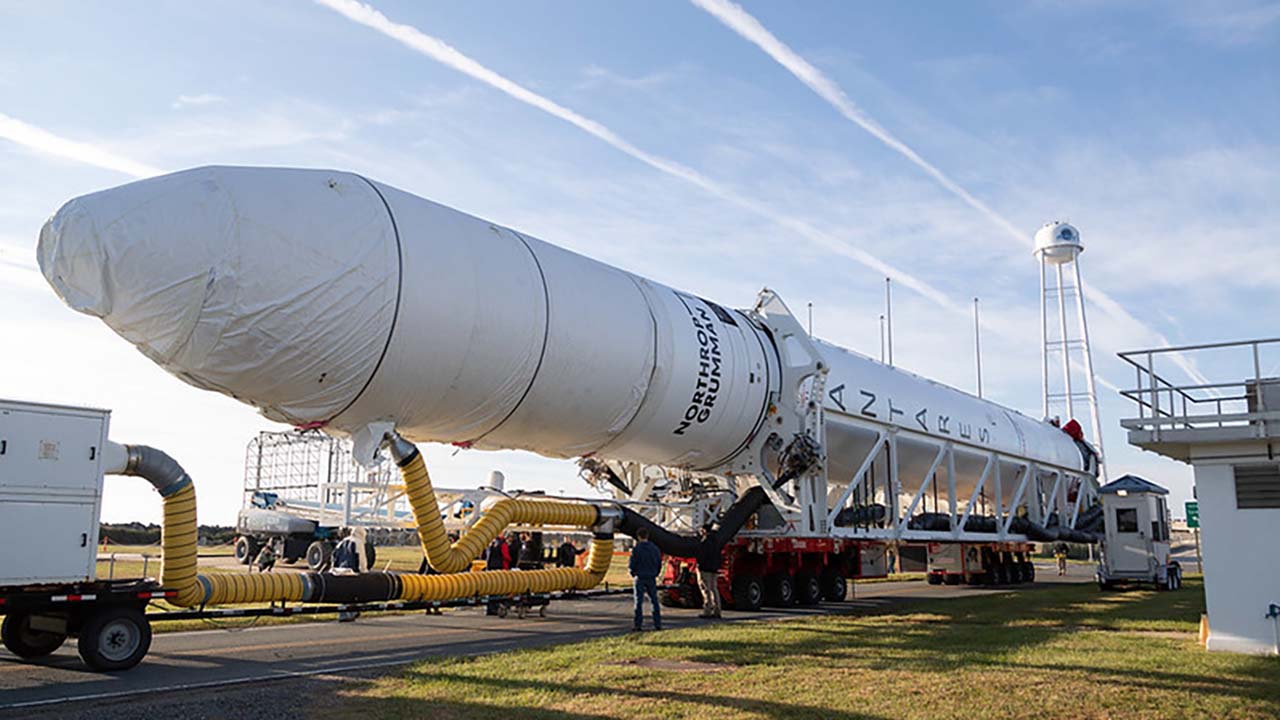 A Northrop Grumman Antares rocket carrying a Cygnus spacecraft is transported horizontally to the Mid Atlantic Regional Spaceports Pad 0A, Wednesday, Nov. 2, 2022, at NASAs Wallops Flight Facility.