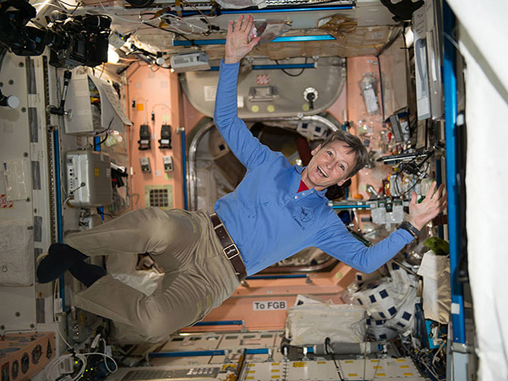 NASA astronaut Peggy Whitson floats through the Unity module onboard the International Space Station.