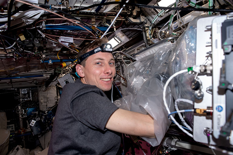 NASA astronaut Woody Hoburg works on the BFF Meniscus investigation on the International Space Station.