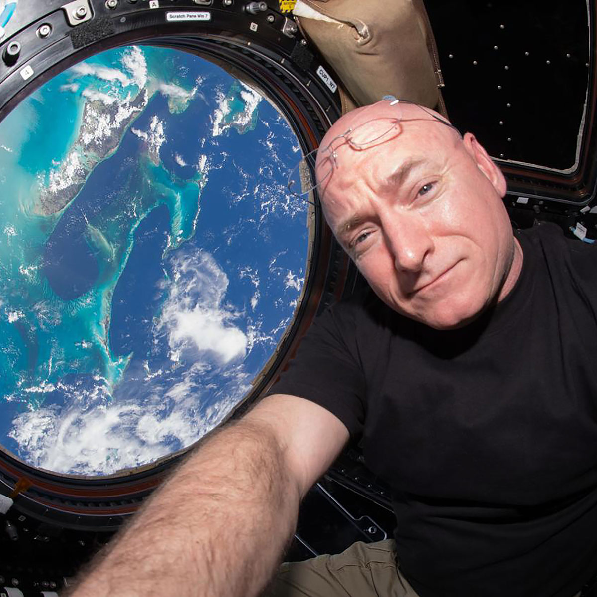 ISS044E011632 (07 12 2015) Expedition 44 flight engineer and NASA astronaut Scott Kelly seen inside the Cupola, a special module which provides a 360 degree viewing of the Earth and the International Space Station. Kelly is one of two crew members spending an entire year in space.