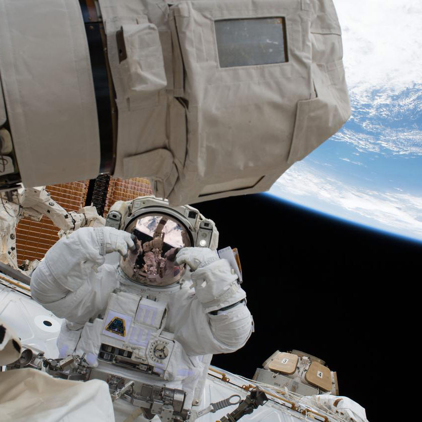 iss054e022826 (Jan. 23, 2018) NASA astronaut Scott Tingle is pictured during a spacewalk to swap out a degraded robotic hand, or Latching End Effector, on the Canadarm2. NASA astronaut Mark Vande Hei also participated in the robotics maintenance spacewalk.