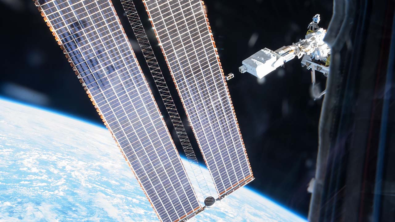 A satellite is ejected from the Japan Aerospace Exploration Agency (JAXA) Small Satellite Orbital Deployer on the International Space Station on Dec. 19, 2016. The satellite is actually two small satellites that, once at a safe distance from the station, separated from each other, but were still connected by a 100 meter long Kevlar tether.
