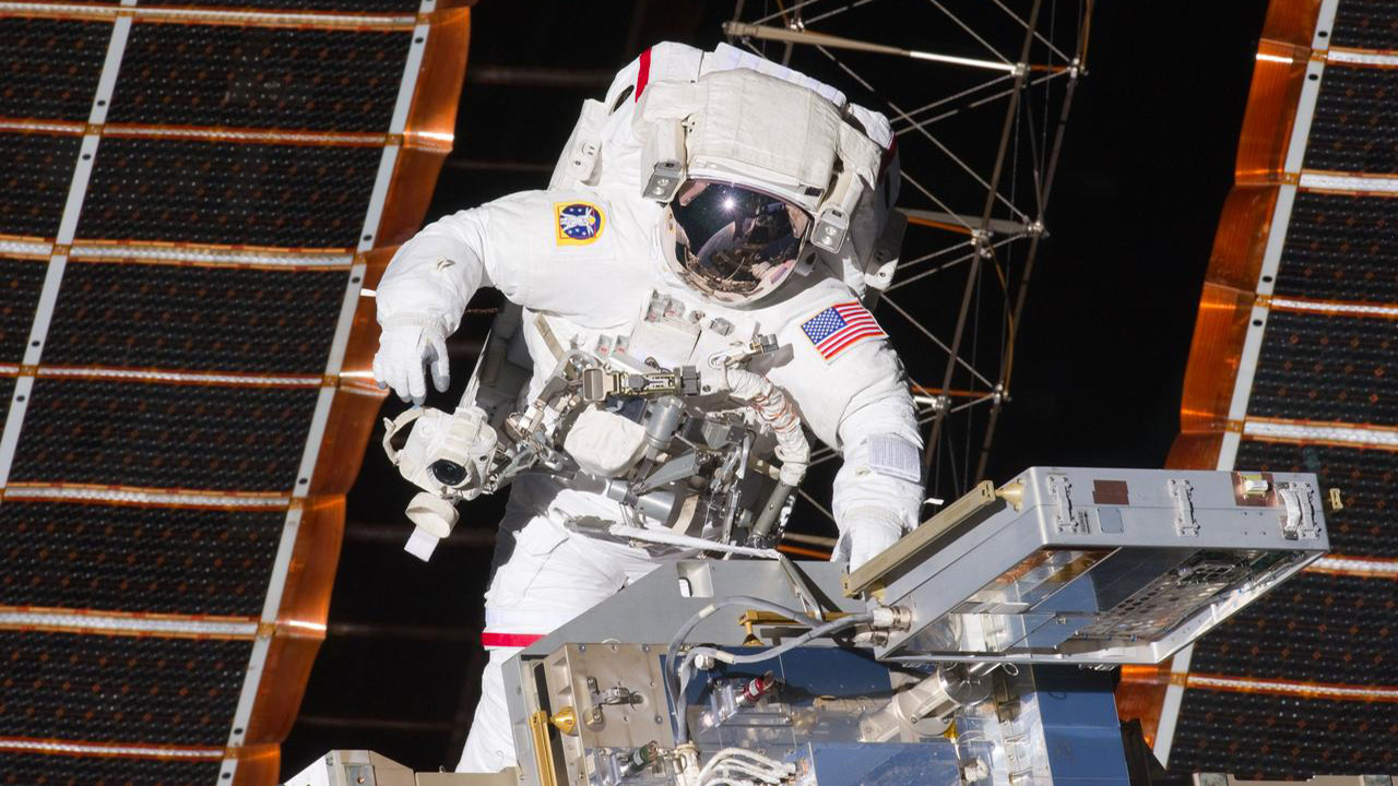 STS 134 Mission Specialist (MS 3) Andrew Feustel working to install a new MISSE on the EXPRESS Logistics Carrier 2 during the first session of Extravehicular Activity (EVA 1).