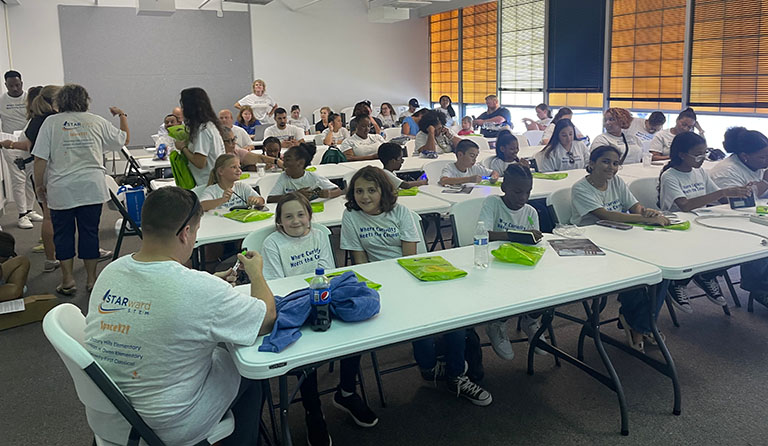 Cumberland County students gather at Kennedy Space Center Visitor Complex to present research projects that will fly to space.