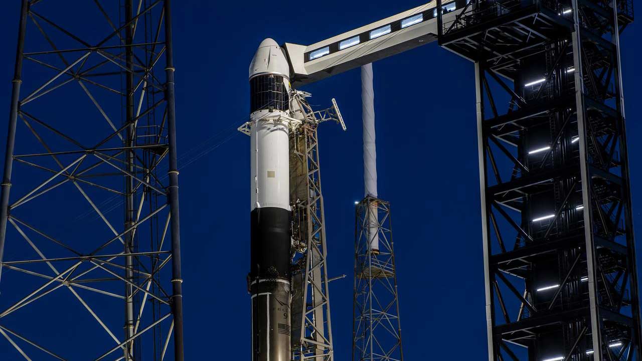 A SpaceX Falcon 9 rocket, with the company’s Dragon spacecraft atop, stands in a vertical position at Space Launch Complex 40 at Cape Canaveral Space Force Station in Florida on Tuesday, March 19, 2024, in preparation for the 30th commercial resupply services launch to the International Space Station.
