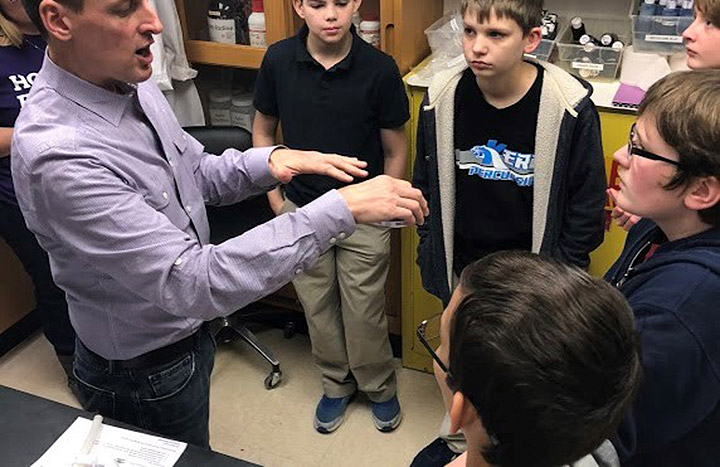 Texas Christian University biology instructor Clark Jones explains the process of growing penicillium mold in the lab.