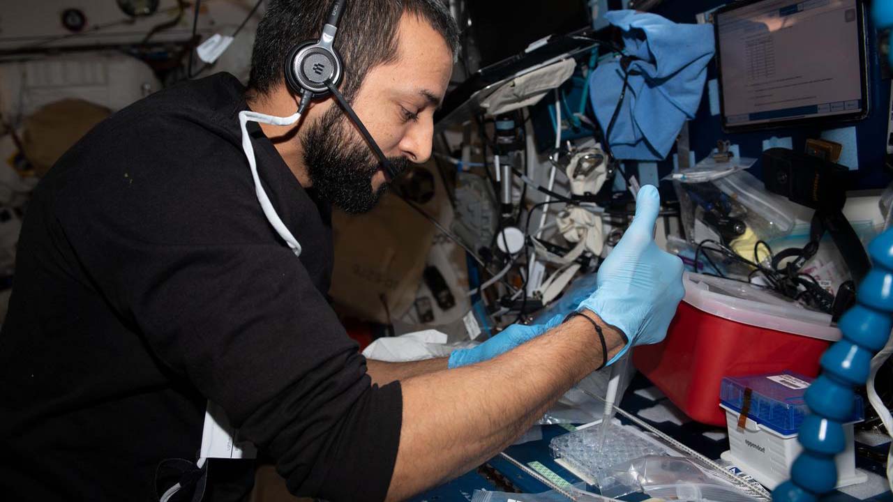 iss069e014677 (May 30, 2023) UAE (United Arab Emirates) astronaut and Expedition 69 Flight Engineer Sultan Alneyadi sets up hardware for the Monoclonal Antibodies Protein Crystal Growth 2 (PCG2) experiment. PCG2 crystallizes biotherapeutics in microgravity and analyzes the process development potentially improving in space and Earth production techniques that may shorten the development cycle for new drugs.