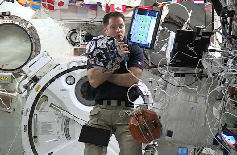 The first SPHERES Tether Demo experiment being performed by European Space Agency astronaut Thomas Pesquet. 