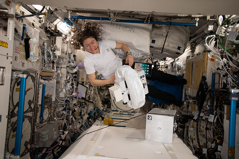 NASA astronaut Christina koch onboard te ISS with Orbit Fabs Flextank TM (left and the rigid tanker (right) during testing.