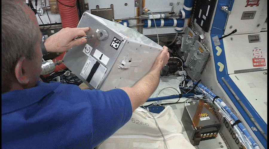 NASA astronaut Christina Koch spins FlexTank during tests onboard the ISS in 2019.