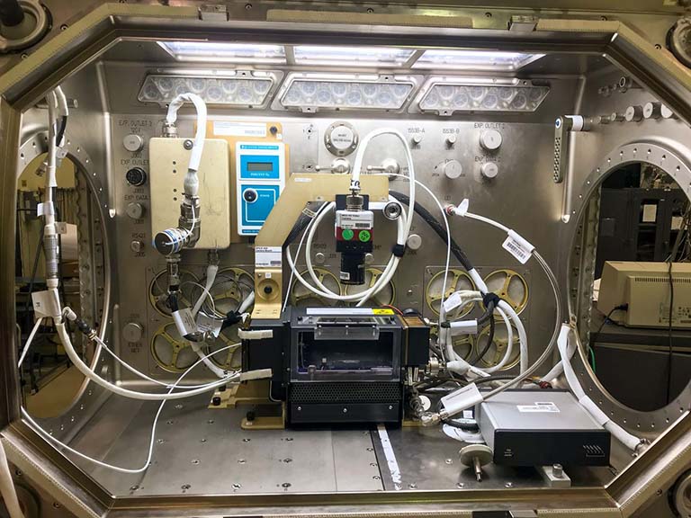 The configuration of the Microgravity Science Glovebox for the confined combustion experiment is shown here before launch.