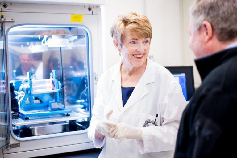 Millie Hughes Fulford speaking with Thomas Lang in her San Francisco VA Medical Center laboratory in 2016.