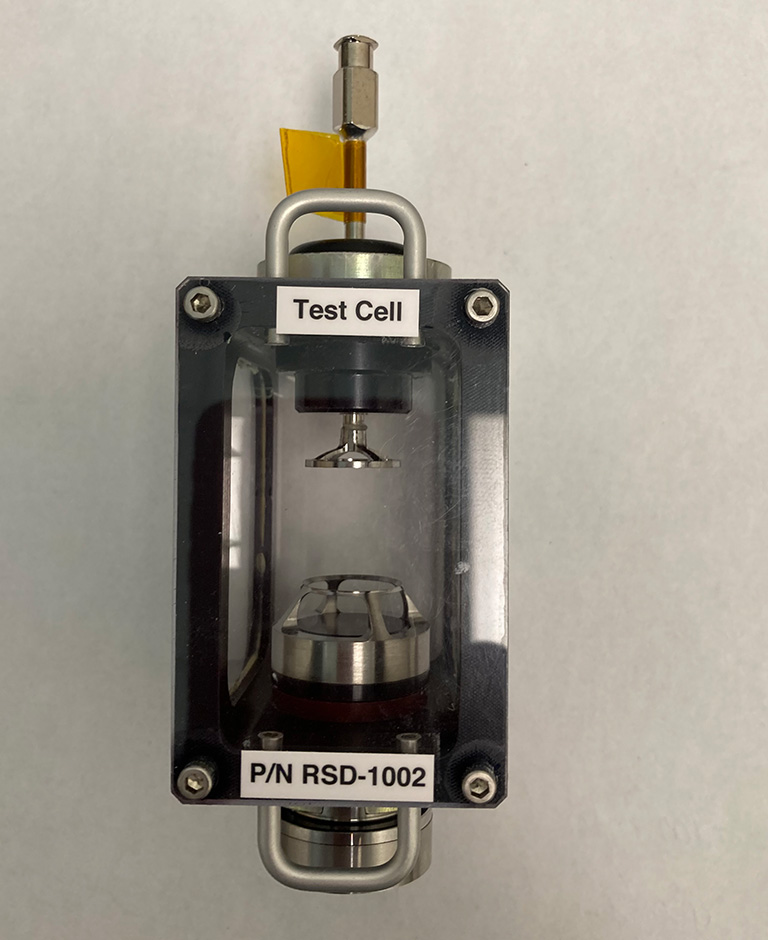 A drop deployment test cell for the Ring Sheared Drop system on the ISS.