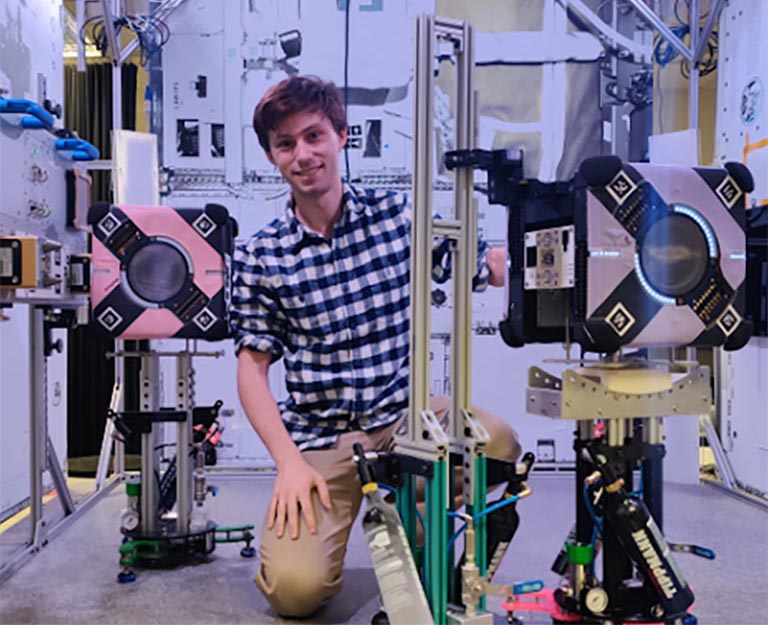 Keenan Albee working with the Astrobee granite table facility at NASA Ames