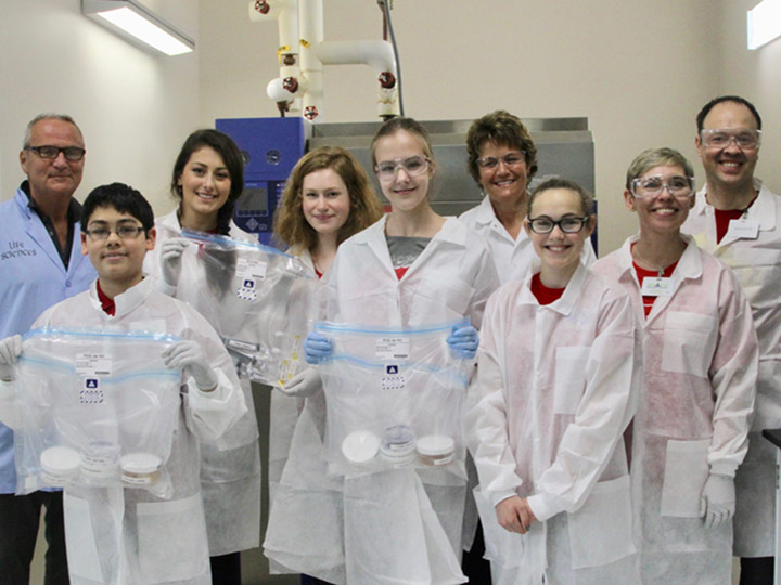 The 2018 Wisconsin Space Crystals team at the Space Life Sciences Laboratory at Kennedy Space Center preparing their samples for launch.