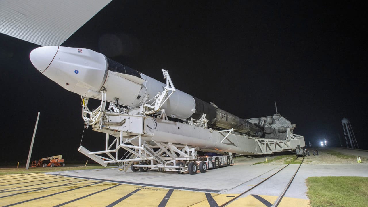ultra-high-definition crew observation of earth picture of rocket on it's side being moved