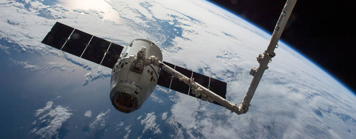 The SpaceX Dragon cargo spaceship is grappled by the International Space Stations Canadarm2. The spacecraft delivered about 7,000 pounds of science and research investigations on April 10, including the Bigelow Expandable Activity Module (BEAM).