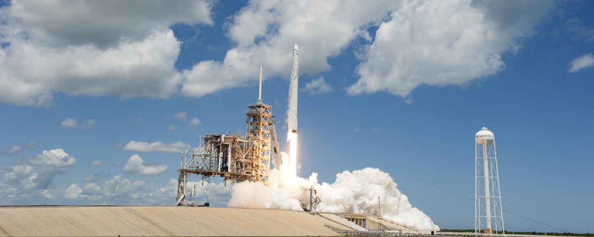 With a backdrop of blue sky and fluffy white clouds, the two stage Falcon 9 launch vehicle lifts off Launch Complex 39A at NASAs Kennedy Space Center in Florida carrying the Dragon resupply spacecraft to the International Space Station. Liftoff was at 12:31 p.m. EDT. On its 12th commercial resupply services mission to the International Space Station, Dragon will bring up more than 6,400 pounds of supplies and new science experiments and equipment for technology research.