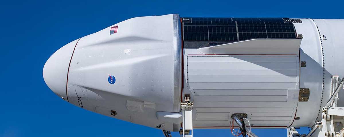 The upgraded version of SpaceX’s Cargo Dragon spacecraft, Dragon 2, is seen atop a Falcon 9 rocket on Dec. 2, 2020, as they prepare to be rolled out at Kennedy Space Center.