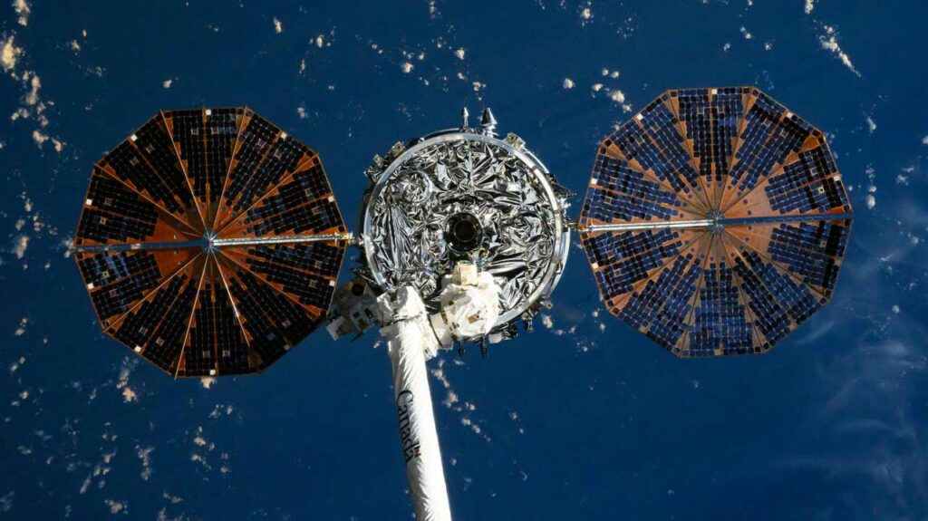 Northrop Grumman's Cygnus space freighter and its two cymbal-shaped solar arrays is pictured attached to the Canadarm2 robotic arm ahead of its release from the International Space Station's Unity module on July 12, 2024.