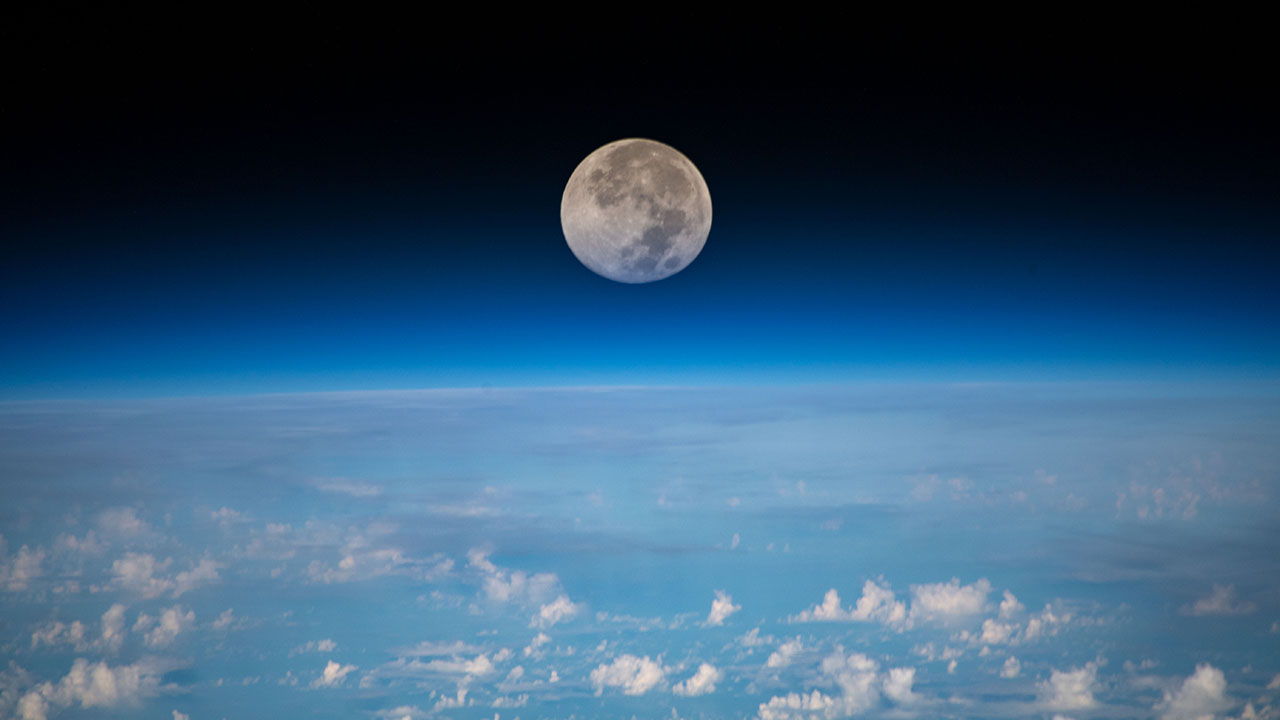 moon-over-clouds The full moon is pictured as the International Space Station orbited 254 miles above the Pacific Ocean northeast of Guam.