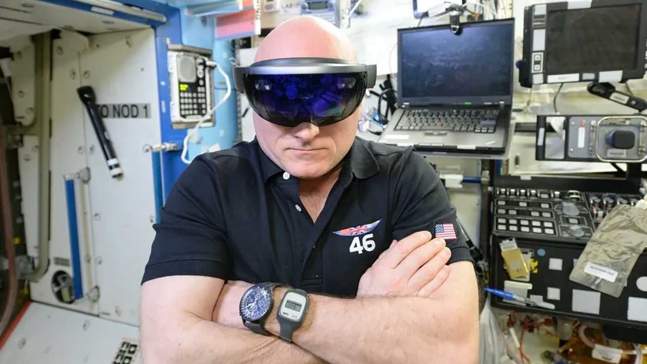 scottkelly-sidekick NASA astronaut Scott Kelly performing checkouts for NASA’s Project Sidekick, which makes use of Microsoft’s HoloLens device.