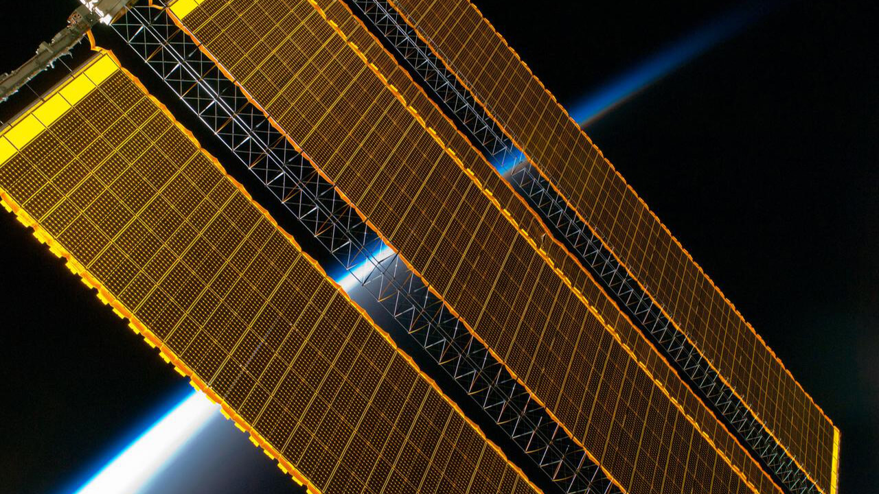 solar-arrays-earth-lim Earth's horizon and station solar array panels are featured in this image photographed by an Expedition 17 crewmember on the International Space Station