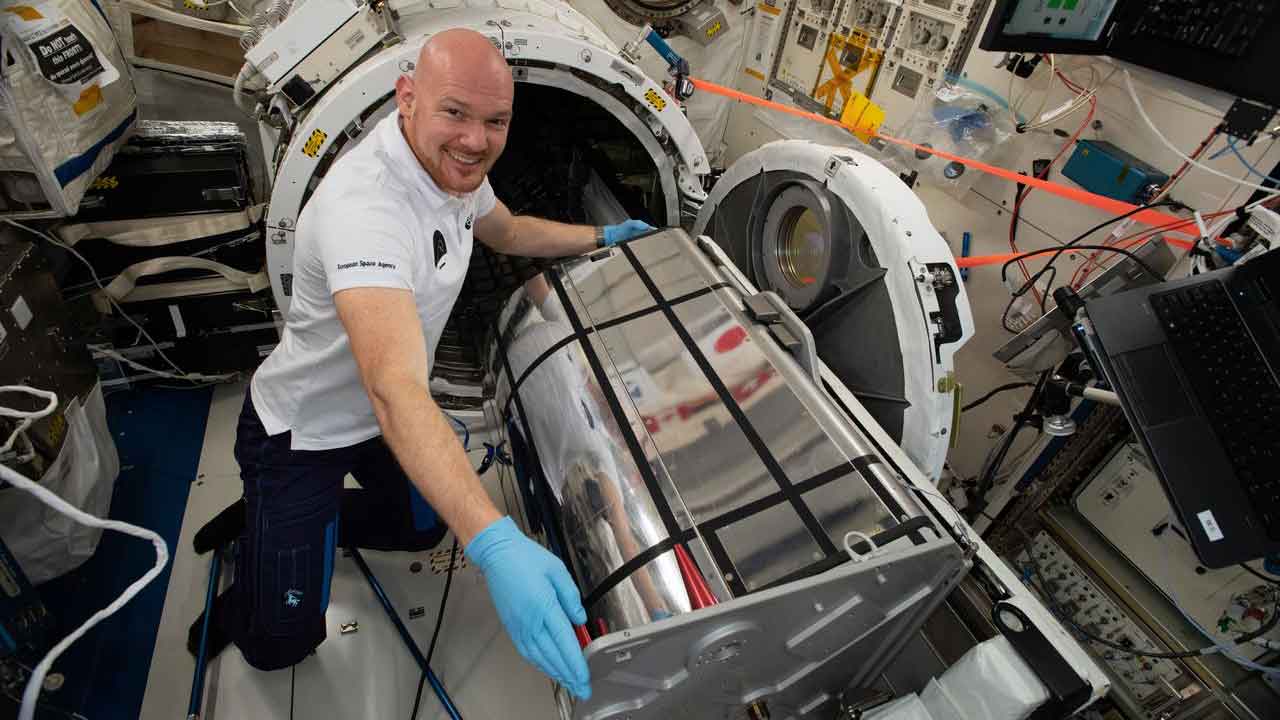 tech-demo-alex-desis Astronaut Alexander Gerst of ESA (European Space Agency) prepares the German Space Agency (DLR) Earth Sensing Imaging Spectrometer (DESIS) investigation for installation.