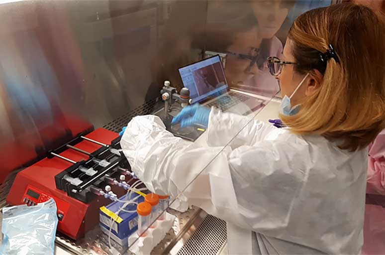 Maddalena Parafati at Kennedy Space Center preparing the programmable syringe pumps that dispense the culture media at fixed reproducible flow rates into the tissue chips.
