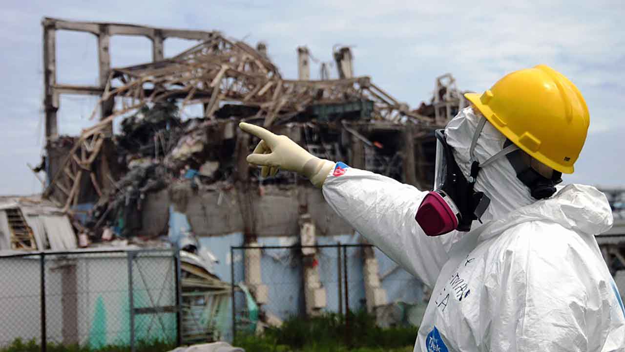 International Atomic Energy Agency (IAEA) team leader Mike Weightman examines Reactor Unit 3 at the Fukushima Daiichi Nuclear Power Plant in 2011 to assess tsunami damage.