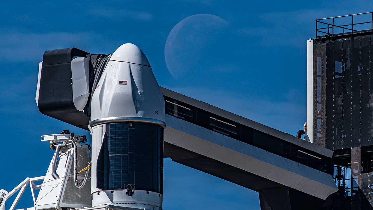 Seen here is a up-close view of the SpaceX Dragon spacecraft atop the company’s Falcon 9 rocket in the vertical position at NASA’s Kennedy Space Center in Florida on March 14, 2023, in preparation for the 27th commercial resupply services launch to the International Space Station.