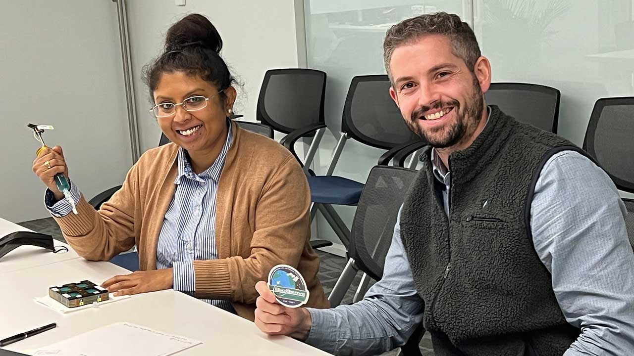 Axonis researchers Tia Dey and Shane Hegarty preparing for the team's ISS National Lab-sponsored investigation.