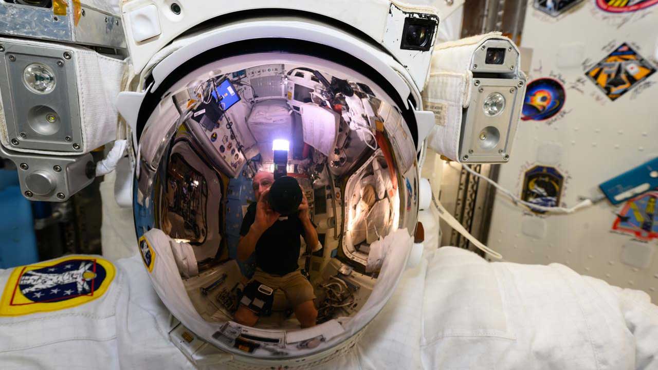 ar24-financials NASA astronaut Don Pettit took this photograph of a U.S. spacesuit helmet with his reflection prominent on the visor inside the ISS's Quest airlock.