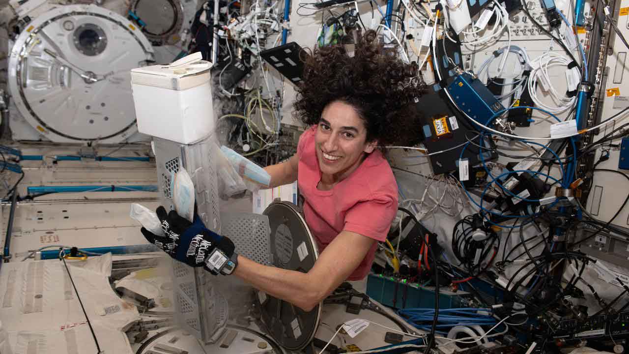 Flight Engineer Jasmin Moghbeli works to retrieve Media Bags for the ISS: Engineering Stem Cell-Derived Cardiac Microtissues with Metabolic Regulators in Space to Promote Cardiomyocyte Maturation (Project EAGLE) investigation